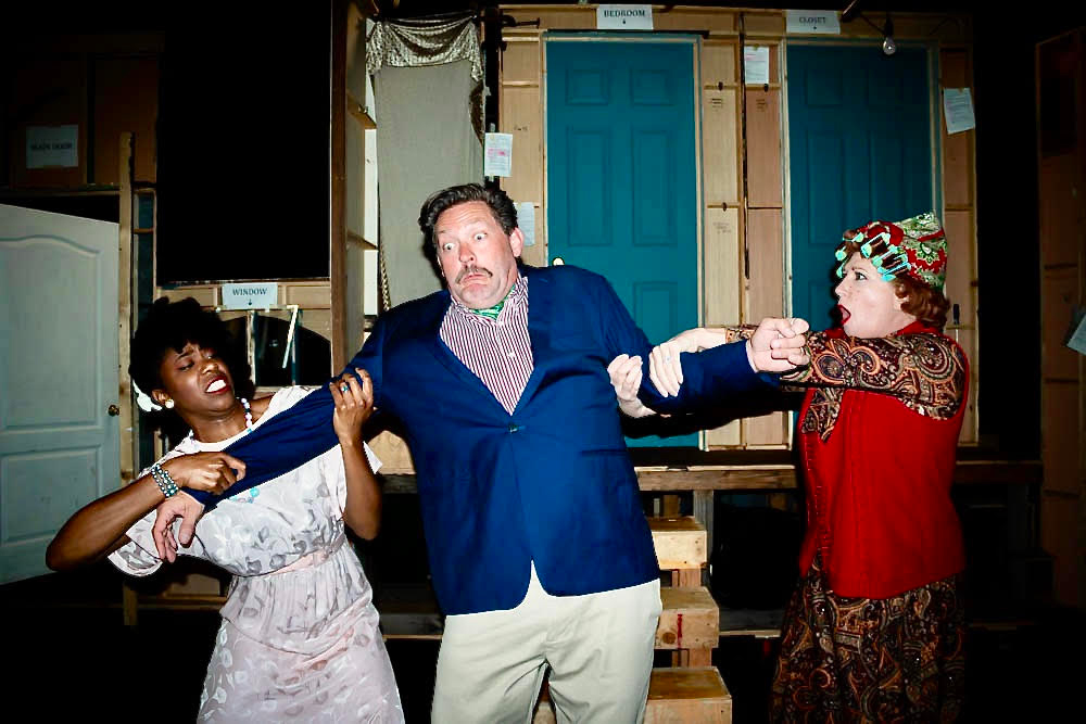 Three cast members rehearsing for the NOISES OFF 2021 opening night at Long Beach Playhouse