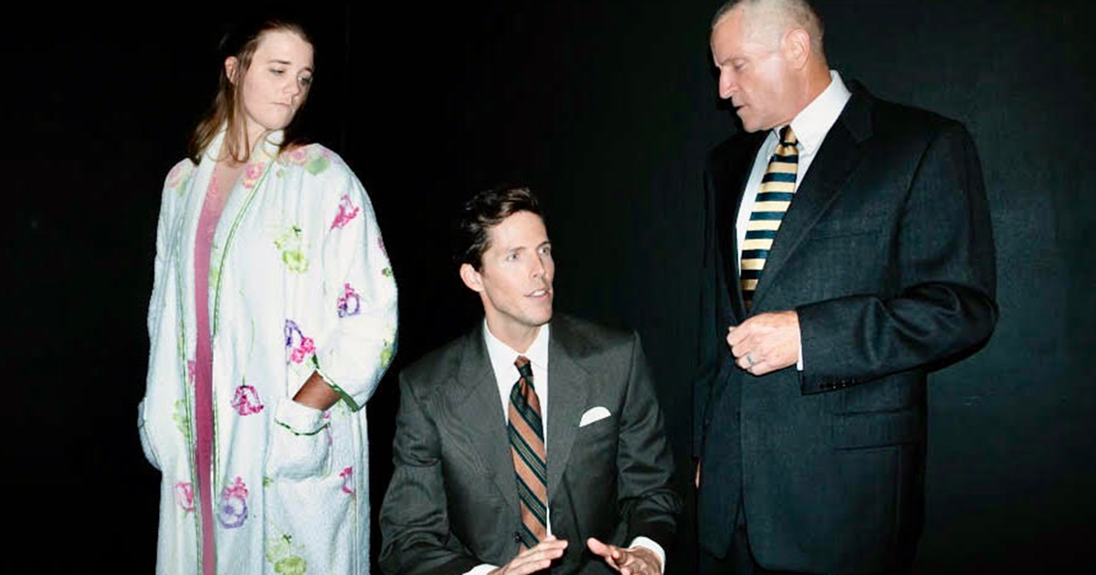 Three cast members of Angels in America Part One at Long Beach Playhouse rehearsing a scene